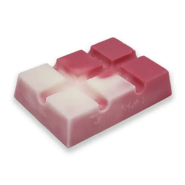 A rectangular, two-toned pink and white Candy Cane Wax Melt with a blocky, geometric design and four raised pink squares on top, reminiscent of an apple strudel treat.