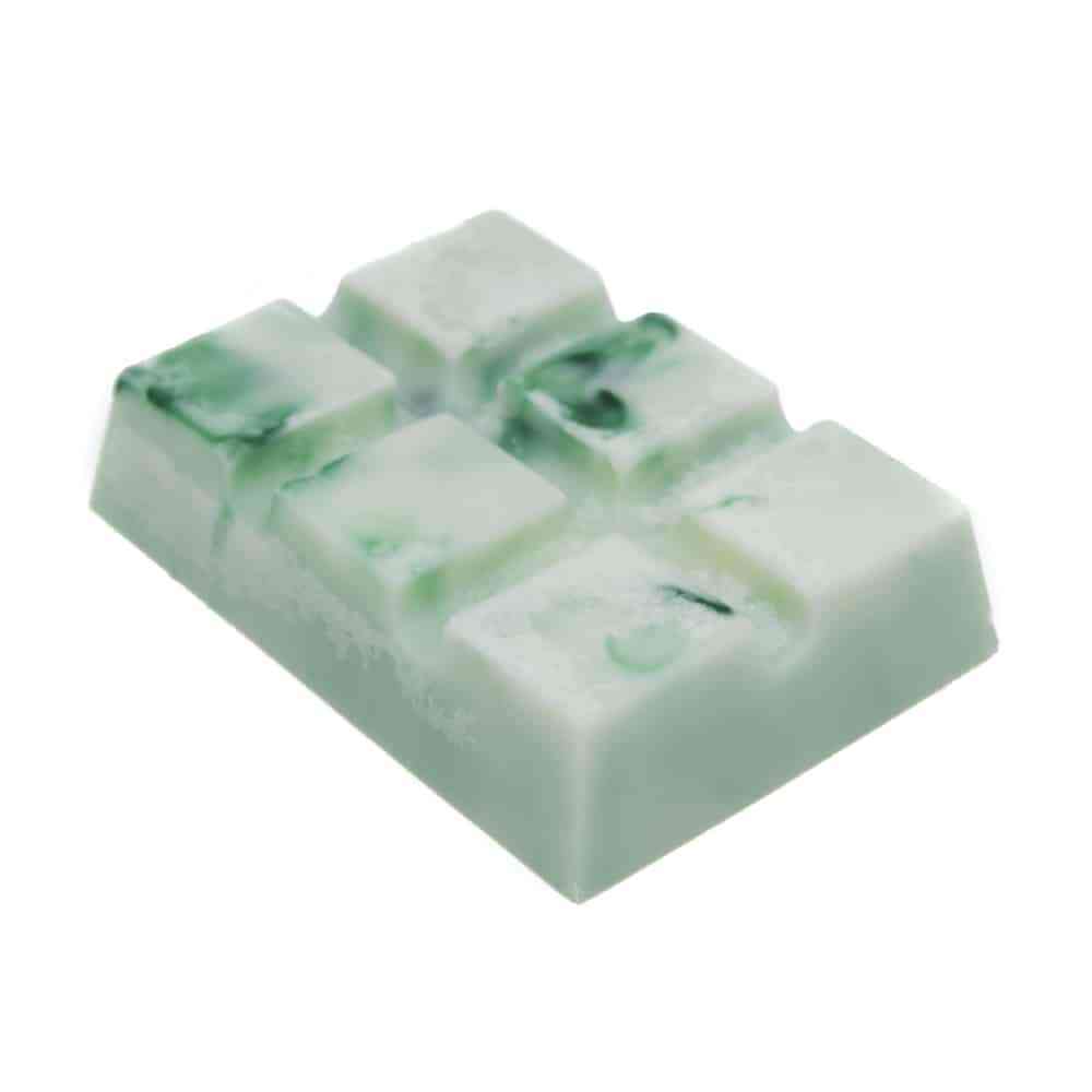 A Sweet Jasmine & Cedar Snap Bar with mint green swirls and a rectangular shape, divided into small square pieces. The surface is smooth with a slight glossy finish, and the bar appears to have a creamy texture.